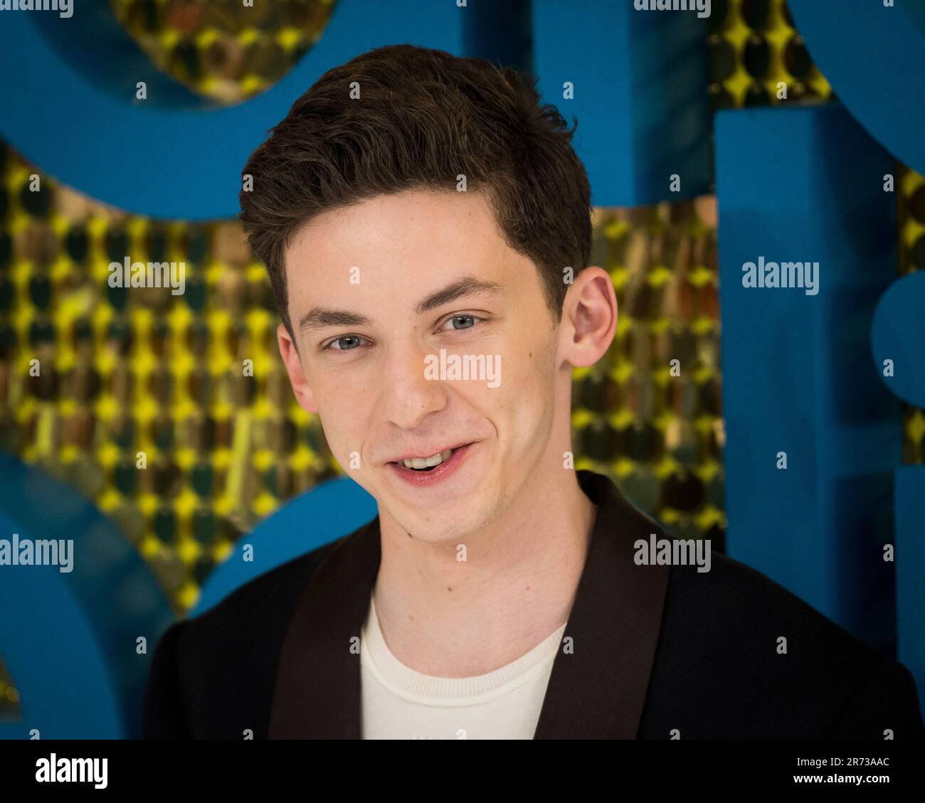Andrew Barth Feldman poses for photographers upon arrival at the