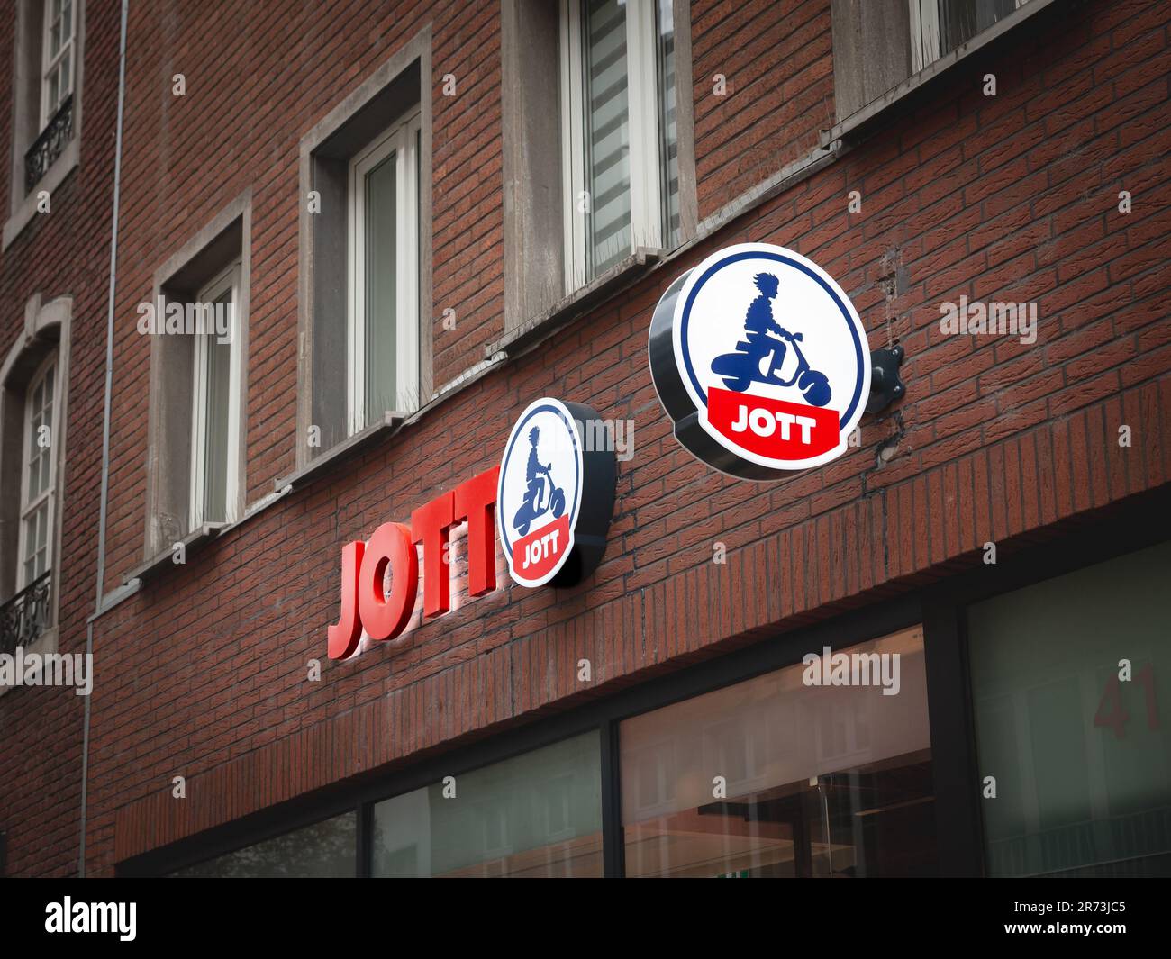Picture of a sign with the logo of JOTT on their local retailer in Dusseldorf Germany. Jott or Just Over The Top is a French fashion retailer and m Stock Photo
