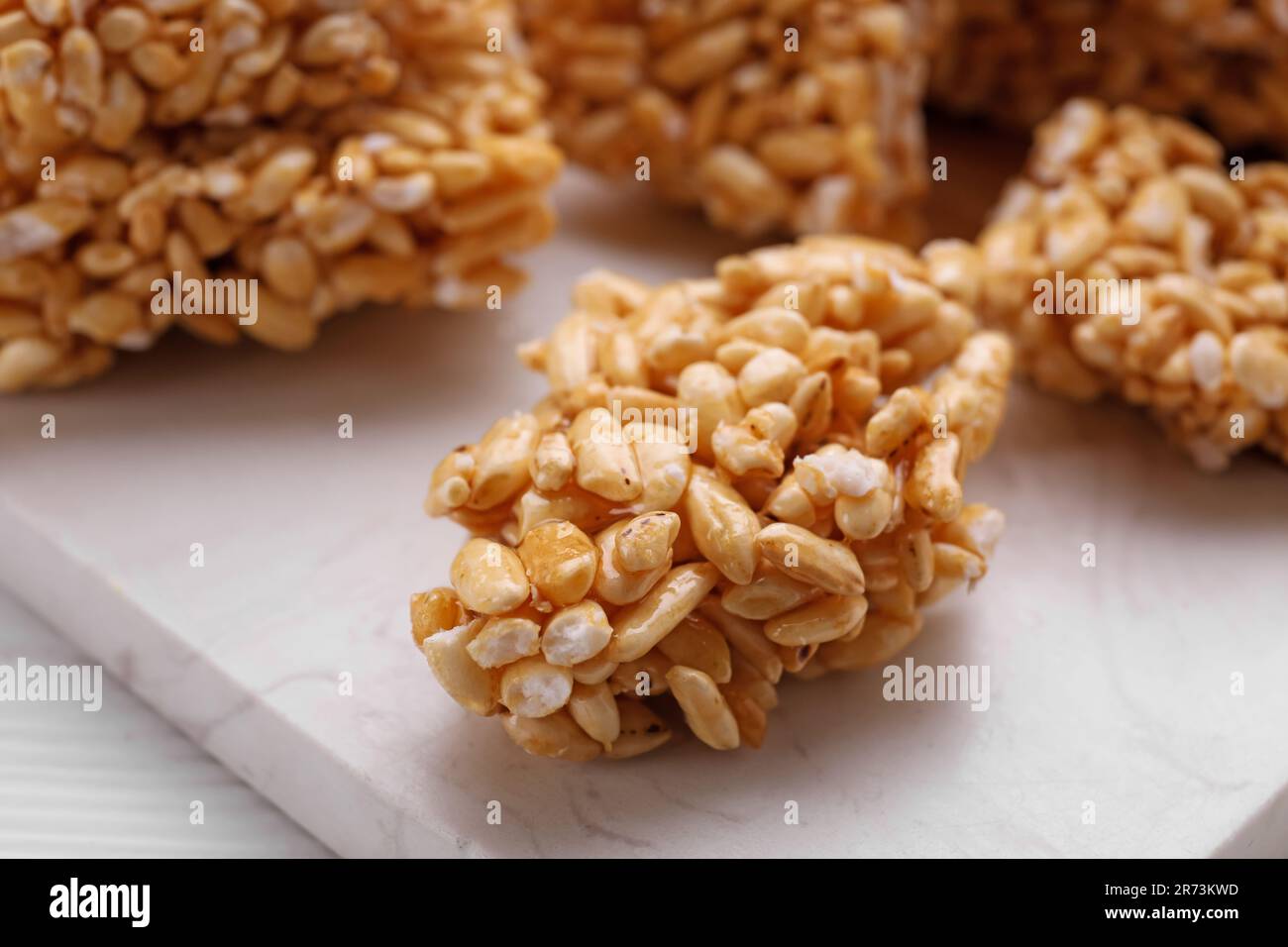 Puffed rice bars (kozinaki) on white table, closeup Stock Photo