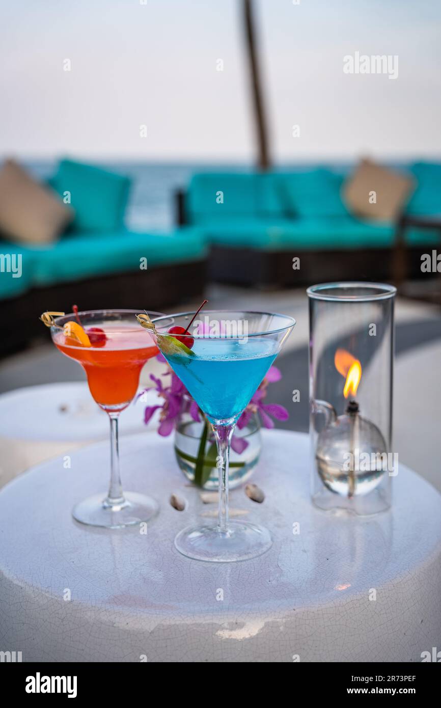 Two cocktails blue and orange at a beach bar in Hua Hin, Thailand Stock ...