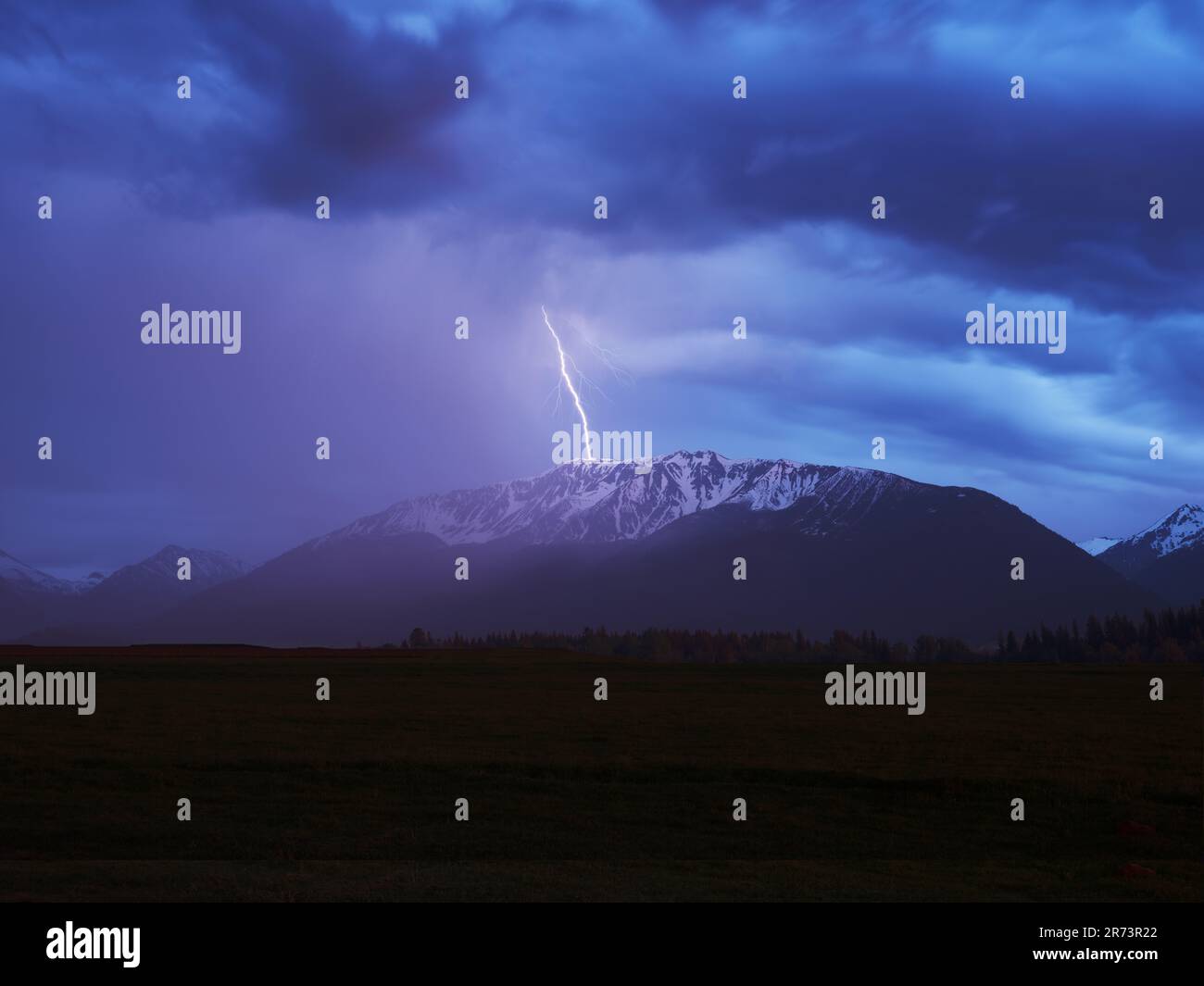 Lightning striking Chief Joseph Mountain, Wallowa Mountins, Oregon Stock Photo