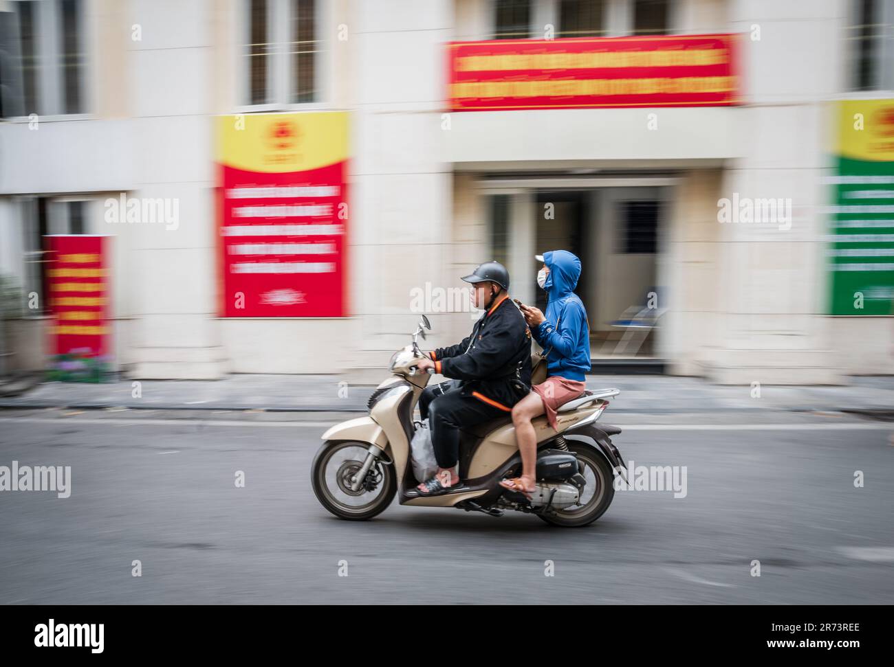 Hanoi, Vietnam, November 15, 2022 Scooter is passing by a party office