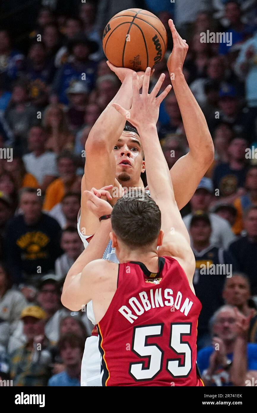 Denver Nuggets forward Michael Porter Jr., top, shoots a 3point basket