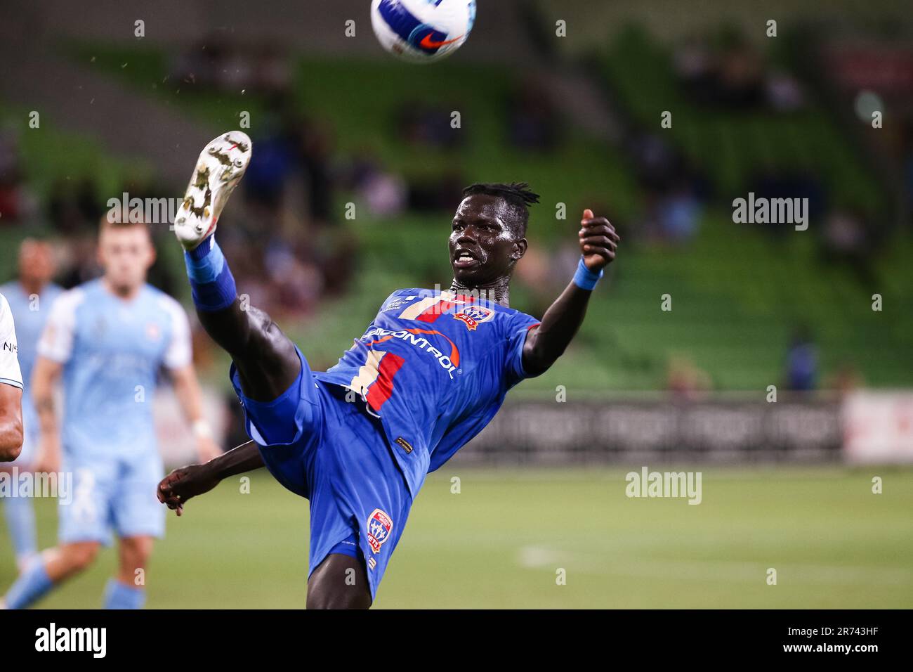 MELBOURNE, AUSTRALIA - FEBRUARY 18: Valentino Yuel of Newcastle Jets kicks the ball during the A-League soccer match between Melbourne City FC and Newcastle Jets at AAMI Park on February 18, 2022 in Melbourne, Australia. Stock Photo