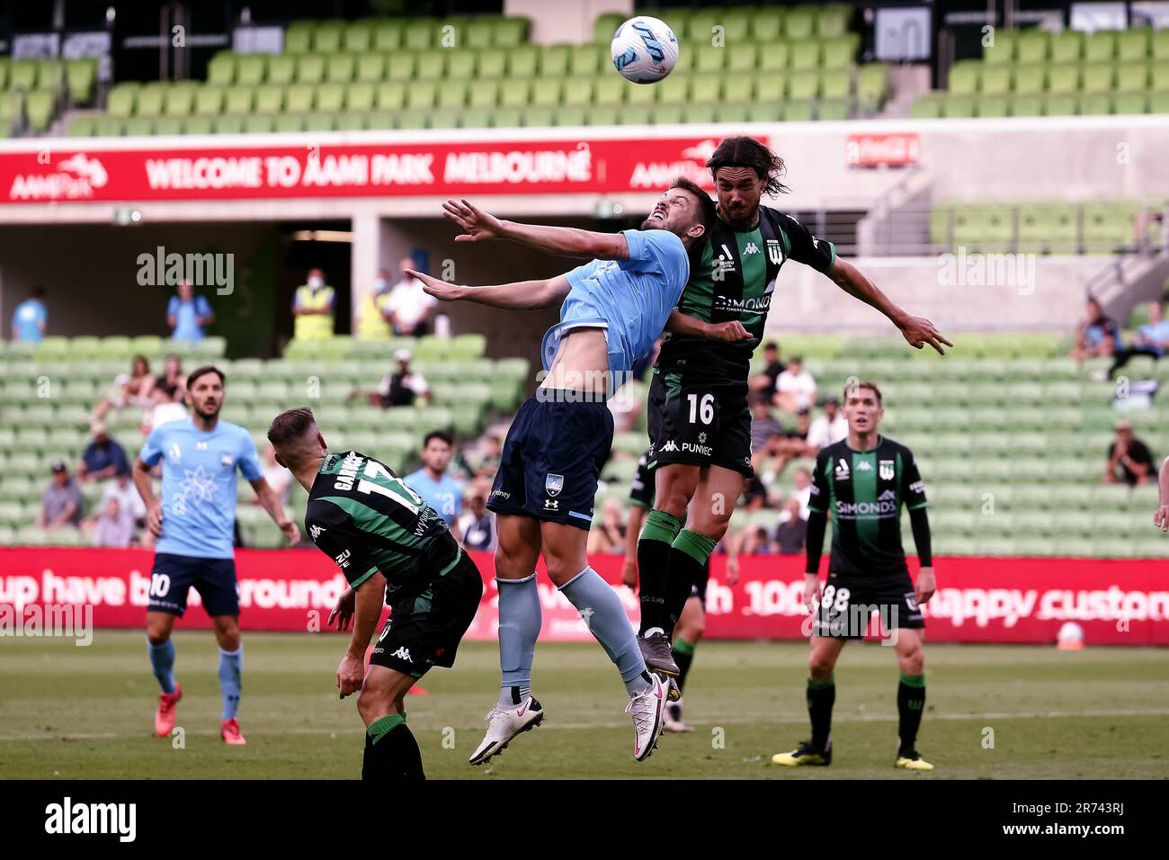 MELBOURNE, AUSTRALIA - FEBRUARY 23: James Donachie of Sydney FC heads the ball ahead of Rene Krhin of Western United during the A-League soccer match between Western United and Sydney FC at AAMI Park on February 23, 2022 in Melbourne, Australia. Stock Photo