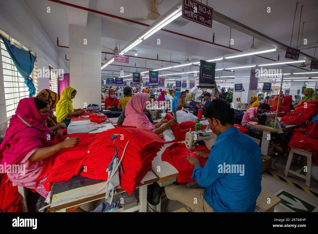 Readymade garments (RMG) workers working in a factory at Fatullah in