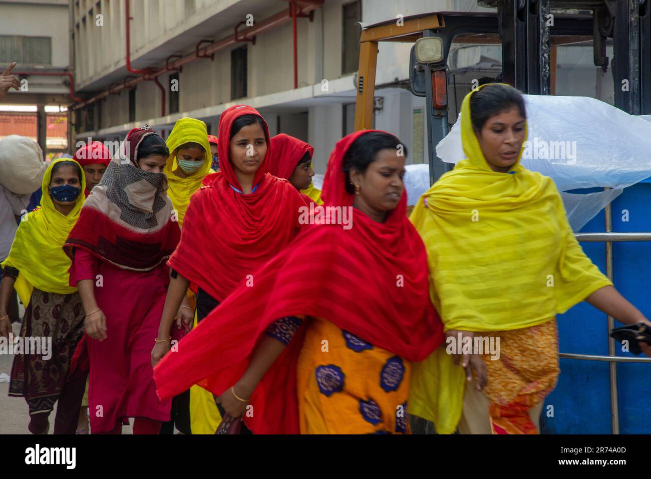 Female workers of a ready-made garment enter in a factory at Fatullah in Narayanganj, Bangladesh. Stock Photo