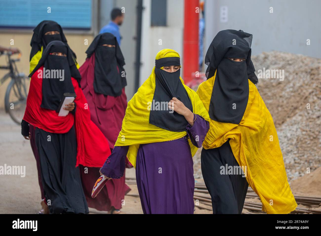 Female workers of a ready-made garment enter in a factory at Fatullah in Narayanganj, Bangladesh. Stock Photo