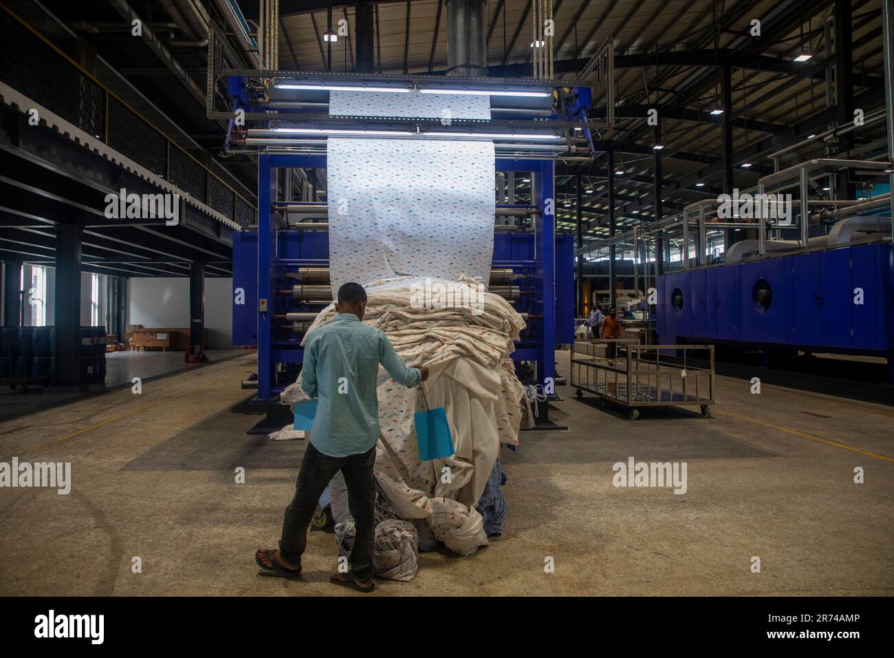 Automatic fabrics printing machine at a textile dyeing plant at