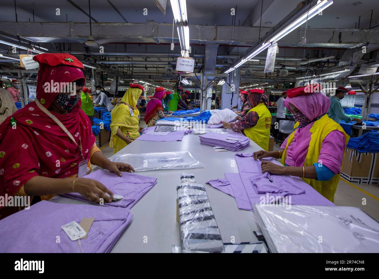 Ready-made garments (RMG) workers working in a factory at Fatullah in Narayanganj, Bangladesh. Stock Photo