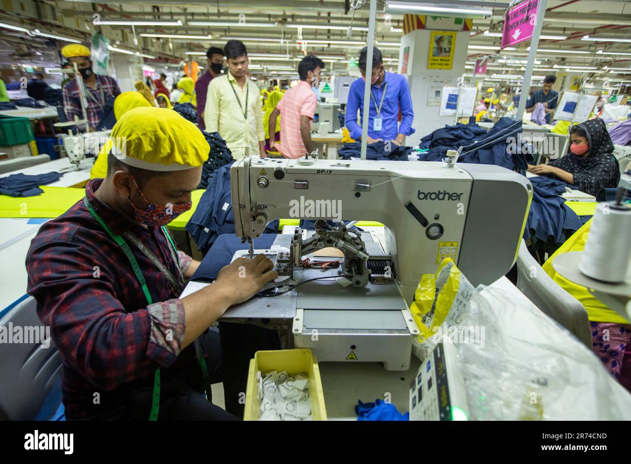 Ready-made Garments (RMG) Workers Working In A Factory At Fatullah In ...