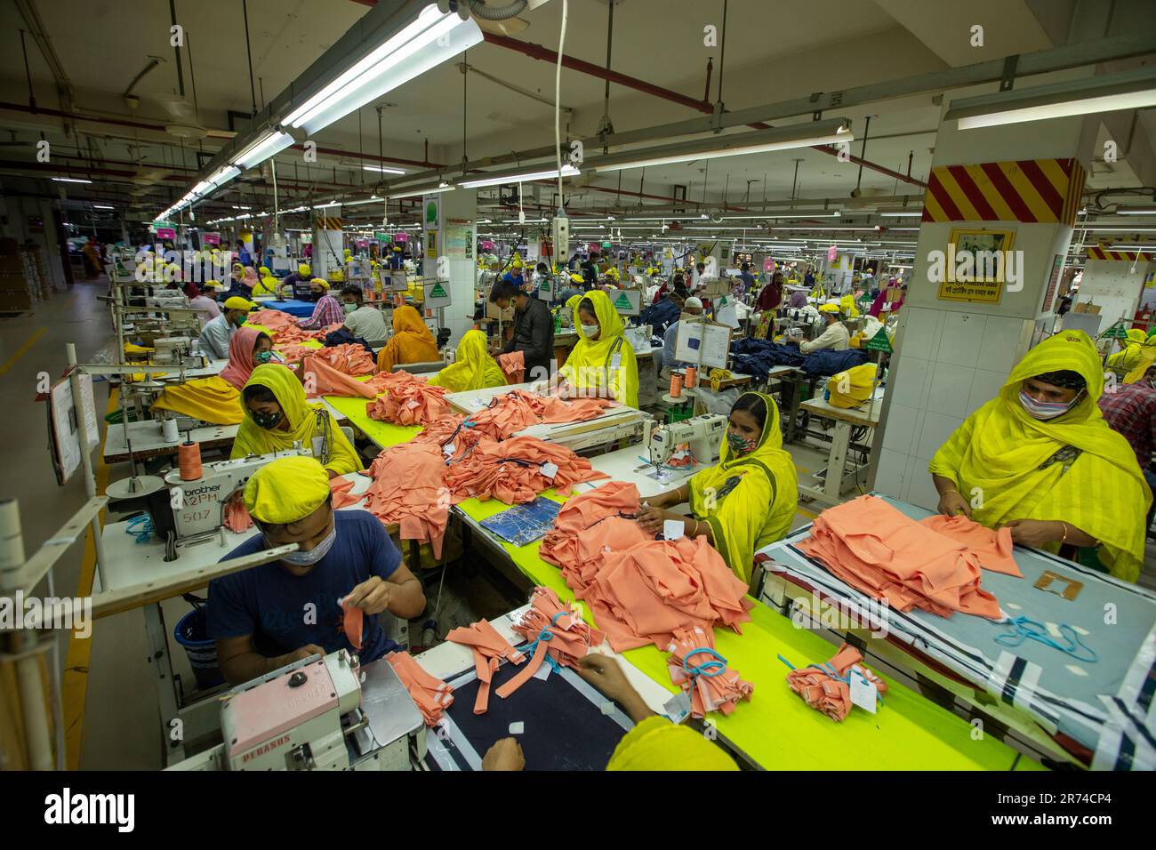 Readymade garments (RMG) workers working in a factory at Fatullah in