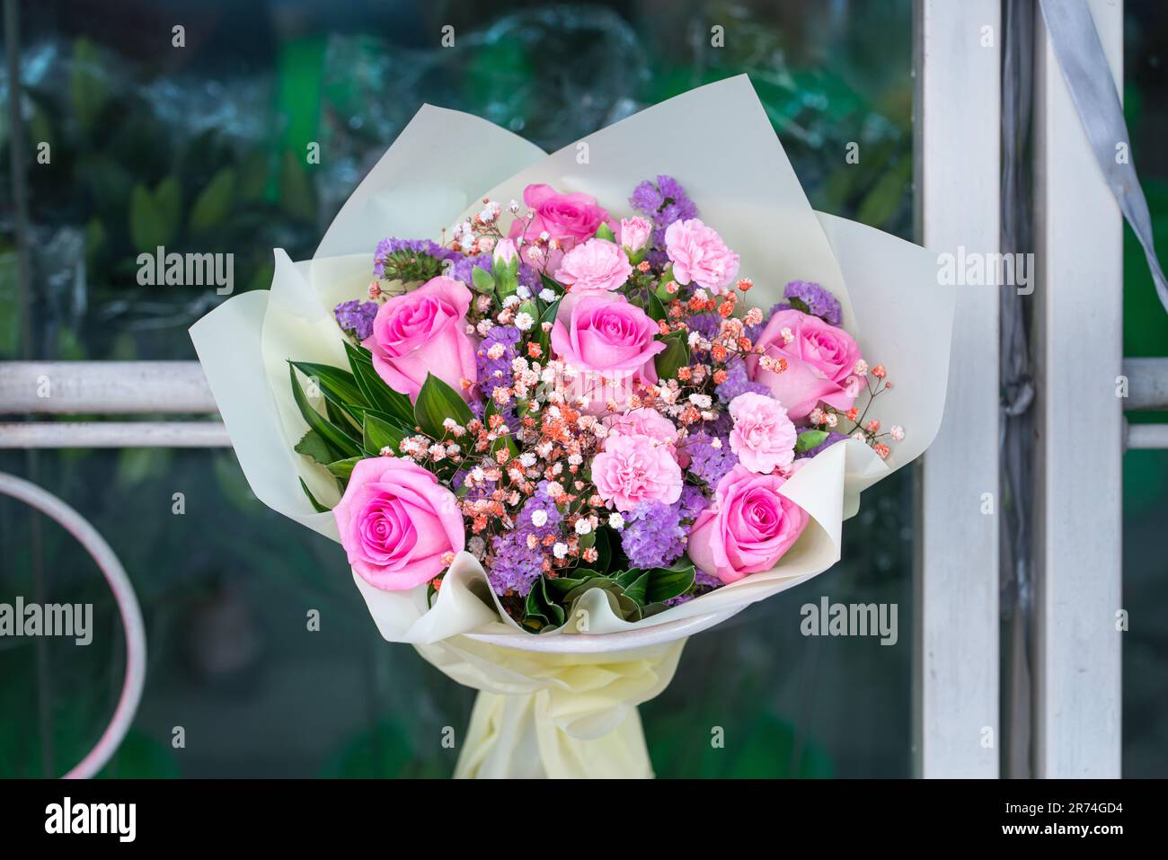Beautiful bouquet of pink roses on display in a florist shop. Stock Photo