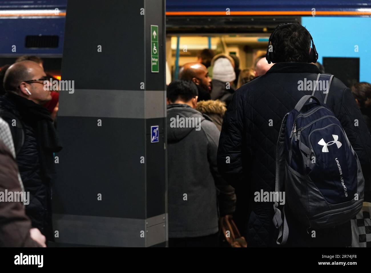 London, United Kingdom - February 01, 2019: Passengers getting on off underground tube train at London Bridge station platform during cold evening, cl Stock Photo