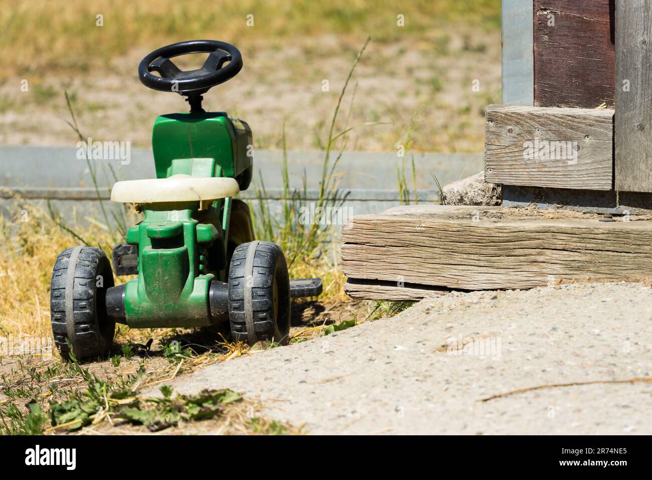 small tractor for children, concept photo for farming succession planning and orphaned parents Stock Photo