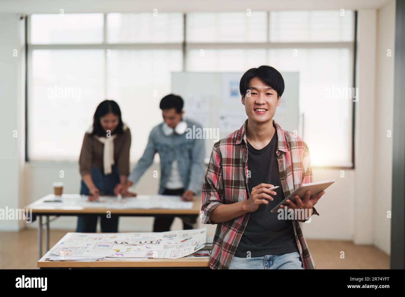 Team of ux developer and ui designer brainstorming interface wireframe ...