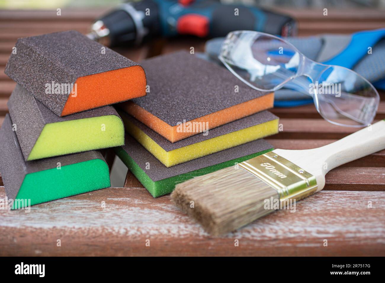 Different sanding sponges with different grit sizes, brush, safety