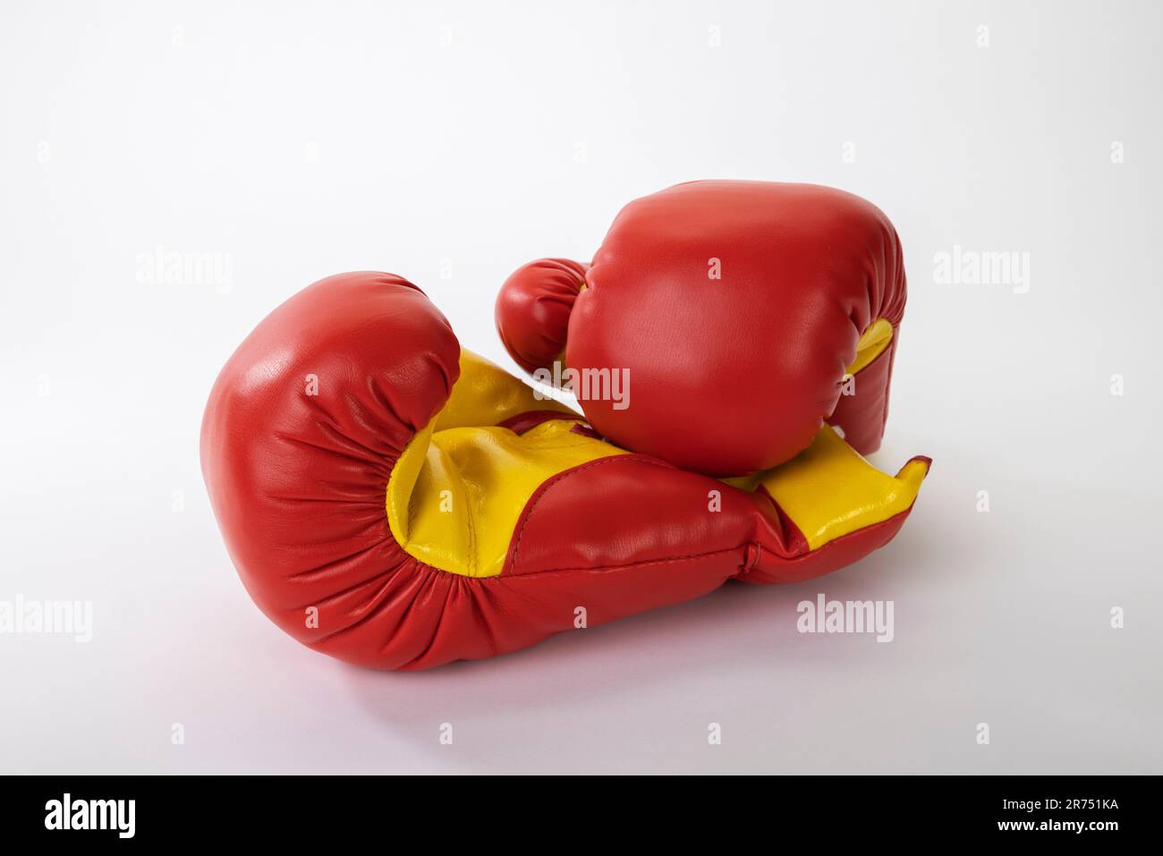Pair of red and yellow boxing gloves, white background, Stock Photo