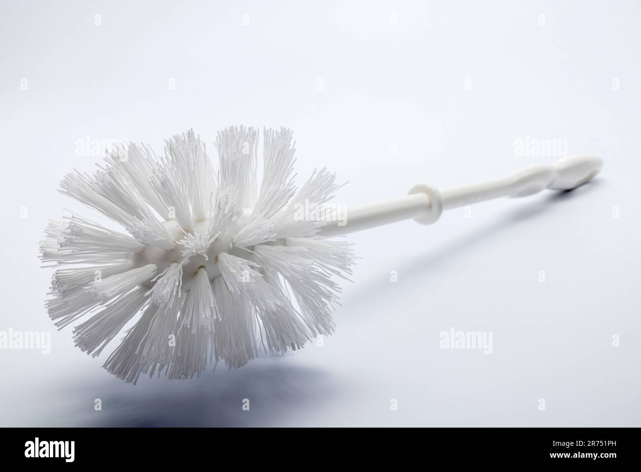 White toilet brush, white background Stock Photo - Alamy