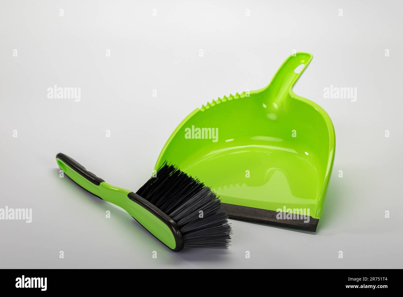 Sweeping set, green, hand brush and dustpan, white background, Stock Photo