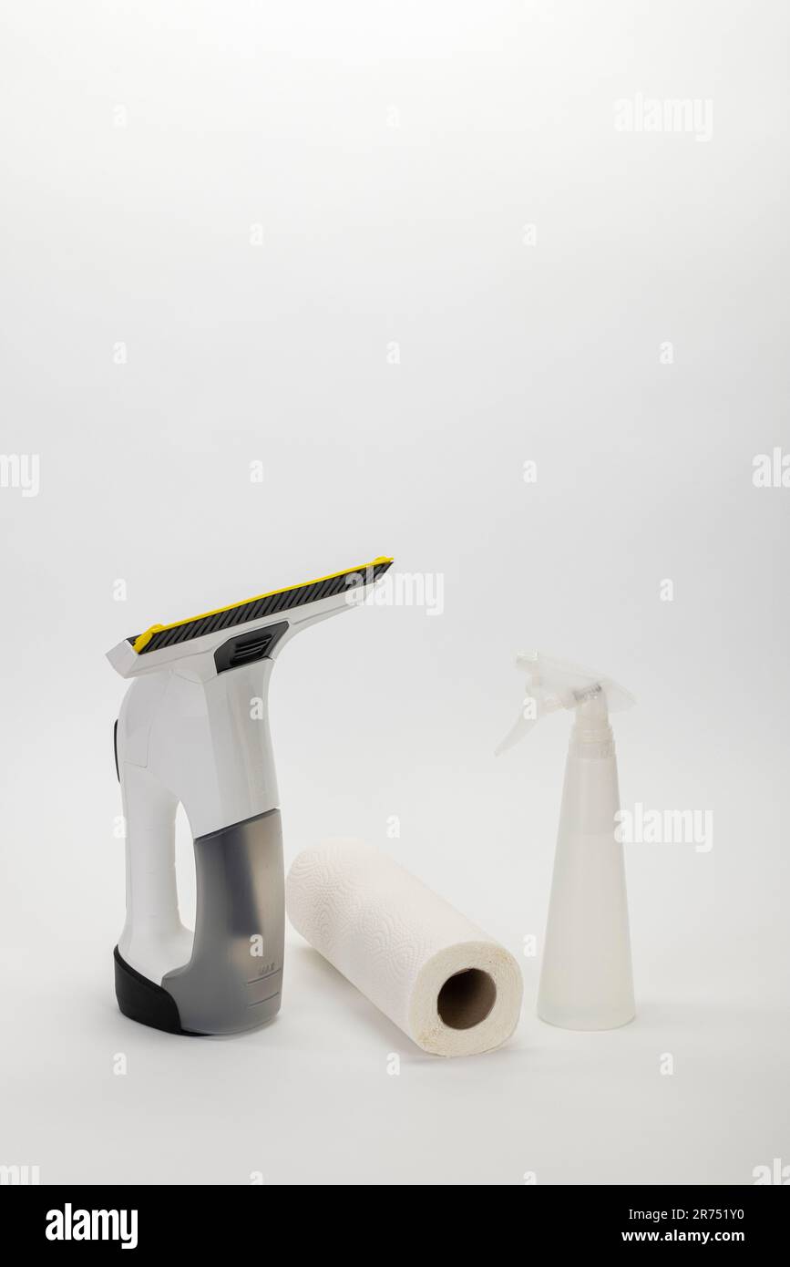 Kärcher battery window vacuum cleaner, kitchen roll, spray bottle with glass cleaner, white background, Stock Photo
