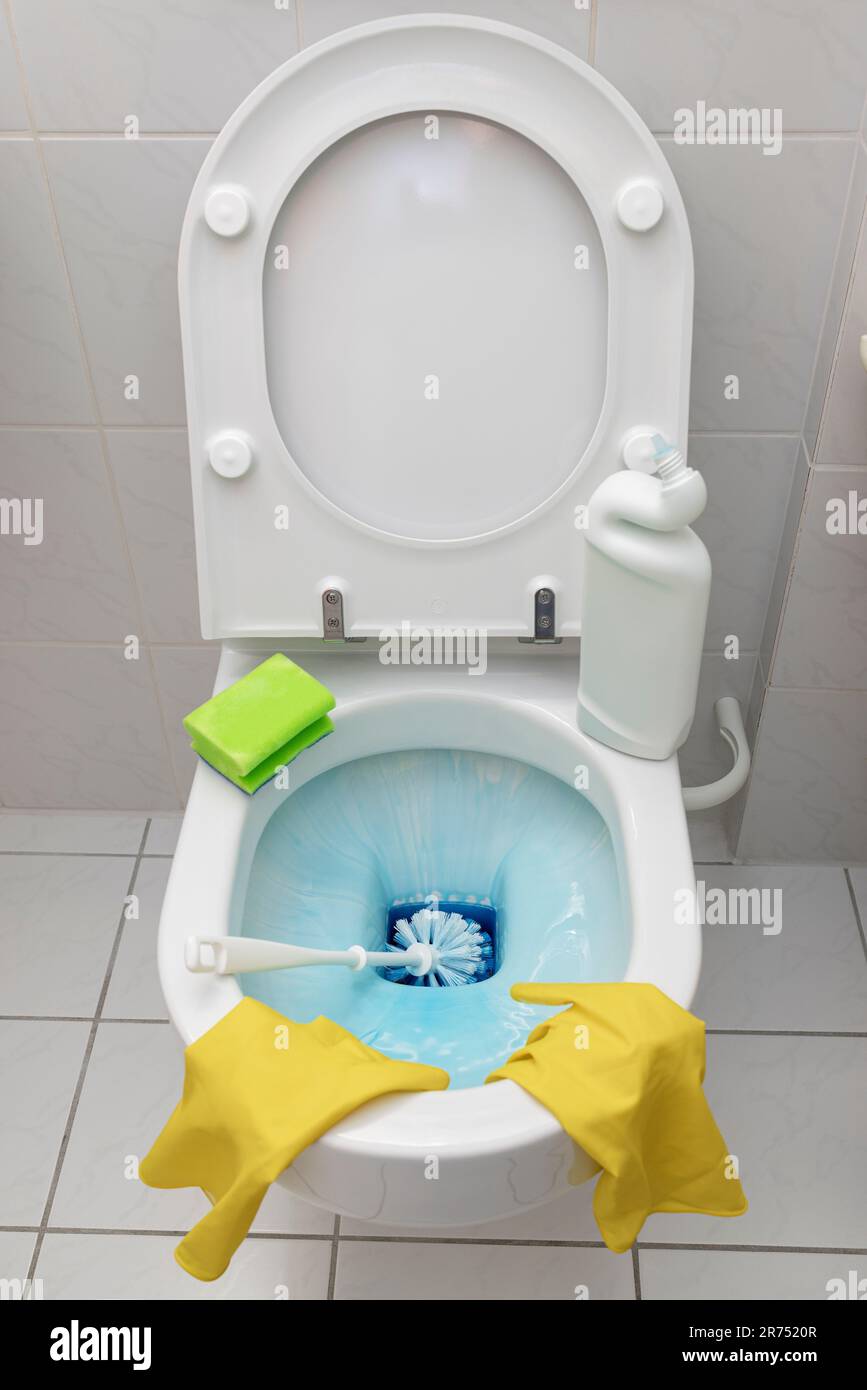 Clean toilet, let liquid toilet cleaner soak, toilet brush Stock Photo