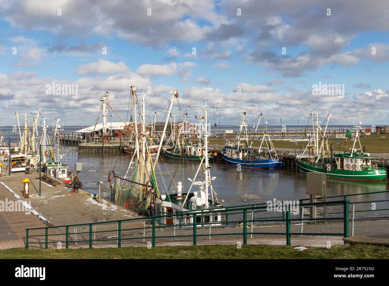 Winter atmosphere, icy harbor, fishing port of Dornumersiel, Accumersiel, East Frisia, Lower Saxony, Stock Photo