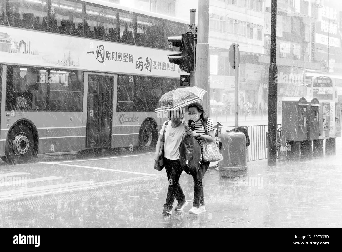 Ordinary Hong Kong People Out and About During A Thunderstorm , Causeway Bay, Hong Kong, China. Stock Photo