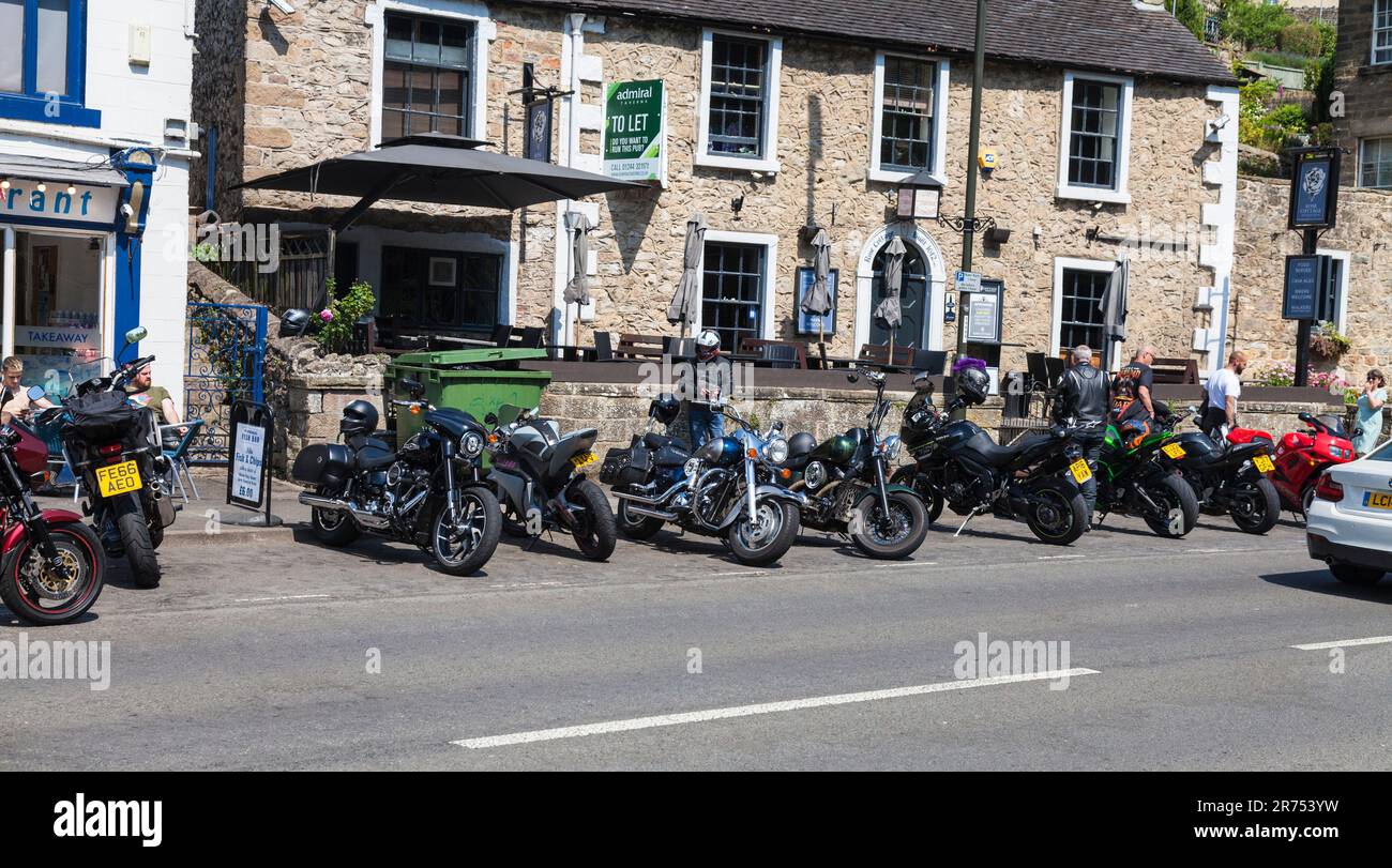 Numerous motor bikes parked up on main street in Matlock Bath