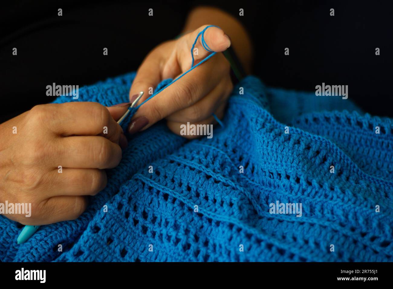 Crochet. Woman Crochet Blue Yarn. Close-up Of The Hands. Stock Photo