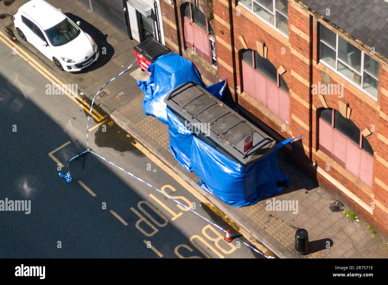 Hunters Road, Hockley, Birmingham 13th June 2023 - West Midlands Police on Hunters Road after a 41-year-old man was stabbed to death at a Birmingham bus stop on Monday evening. A forensic officer was seen using a scanner to map the crime scene in the Hockley area of the city. Officers have arrested two people. Paramedics called police to Hunters Road in Hockley just after 8pm yesterday, but despite their efforts the 41-year-old man died at the scene. His family has been informed. Credit: Stop Press Media/Alamy Live News Stock Photo