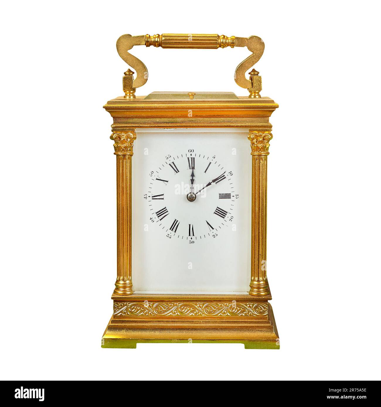 Authentic ancient gold plated small table clock isolated on a white background Stock Photo