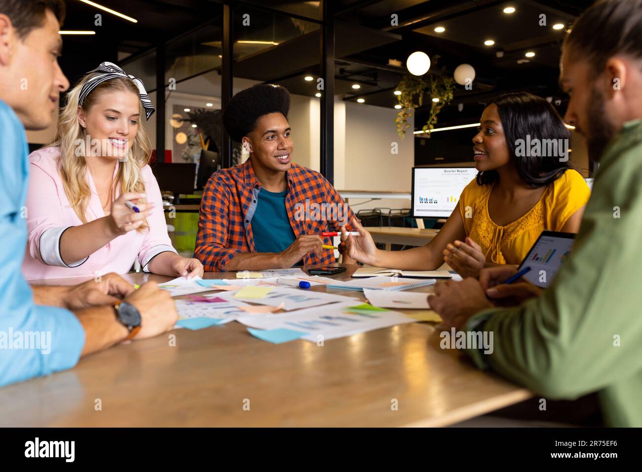 Happy diverse creative colleagues in discussion brainstorming using ...