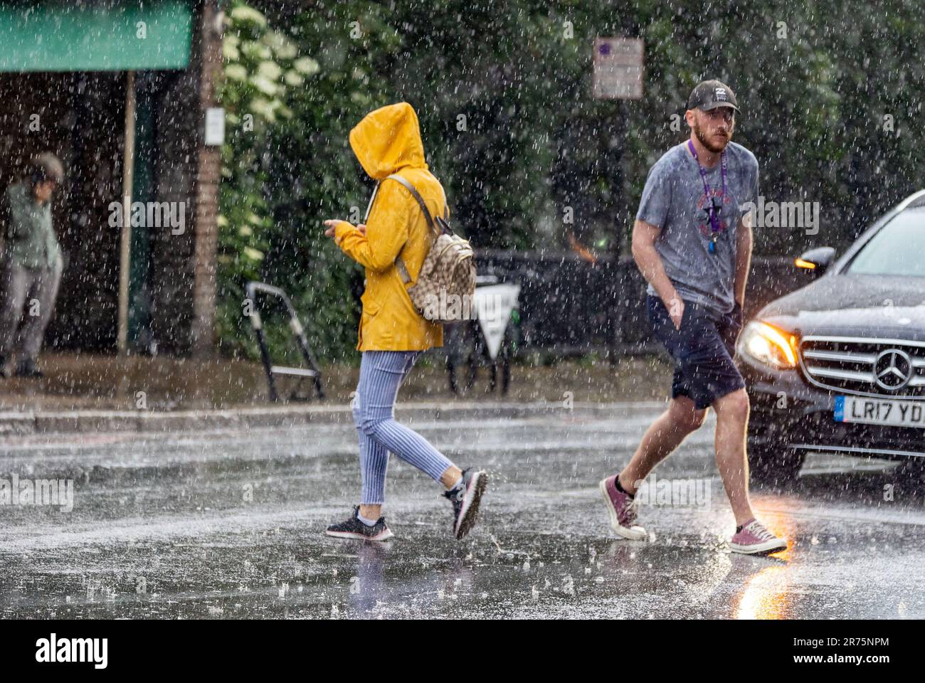 Pic shows: Flash storm hits LondonHighgate sun worshippers were caught out by thunder and lightning in Highgate North London Dress for the heatwave Stock Photo