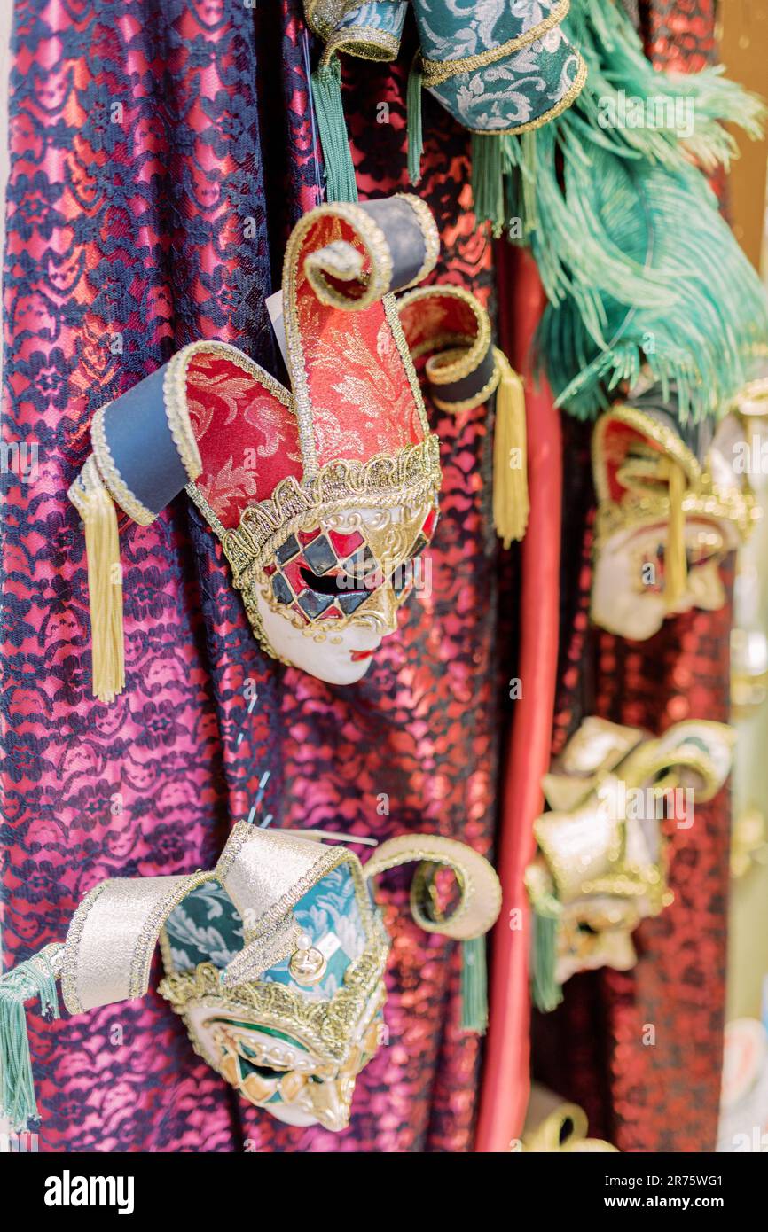 masks hang from the ceiling. Different colored fabrics can be