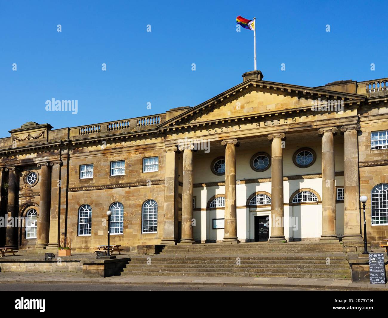 Pride flag flying over the Castle Museum in York Yorkshire England Stock Photo