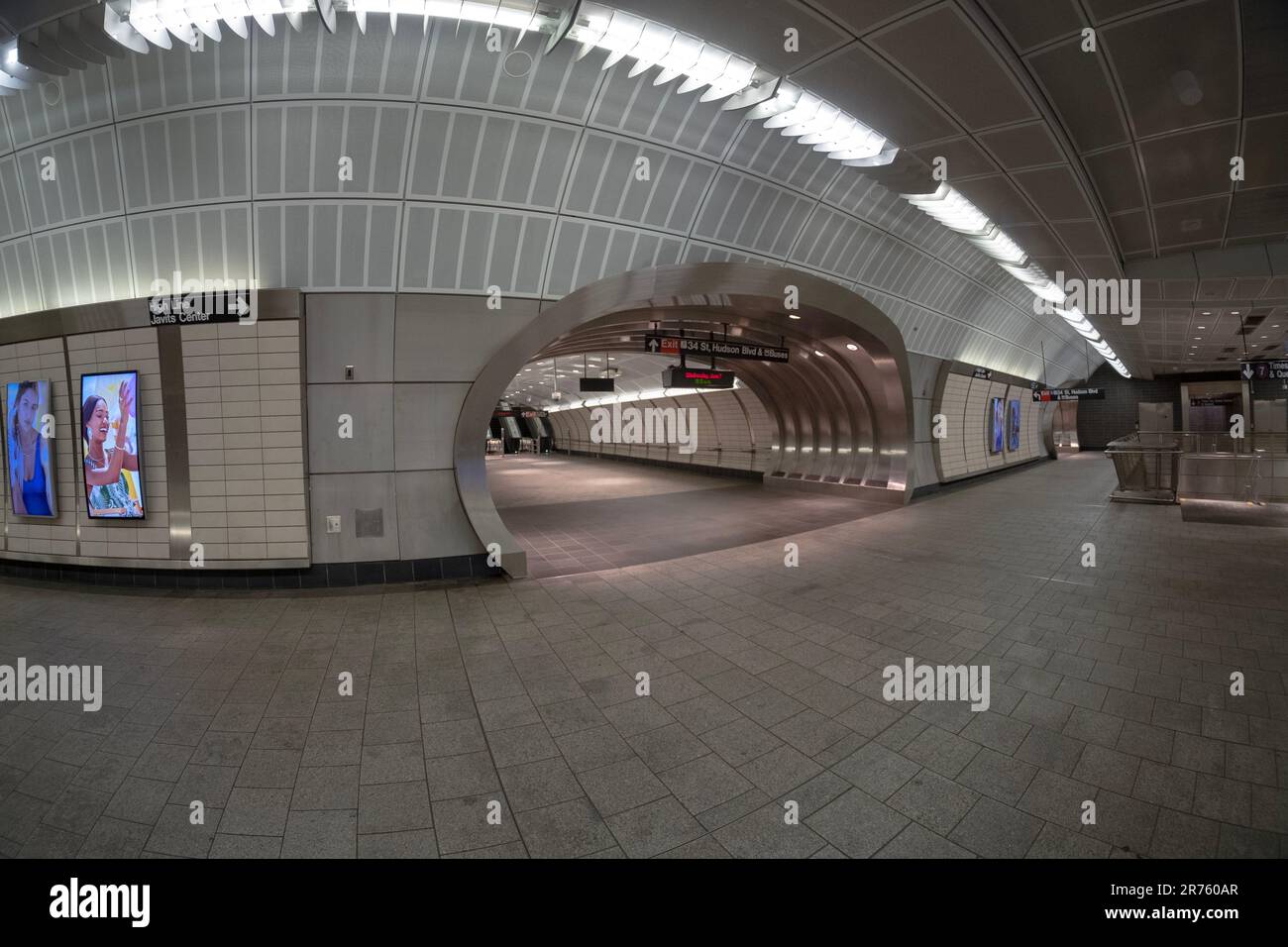 A fisheye lens view of the mezzanine of the last stop on the #7 subway and a walk to the exit on 34th Street Hudson Yards. In new York City. Stock Photo