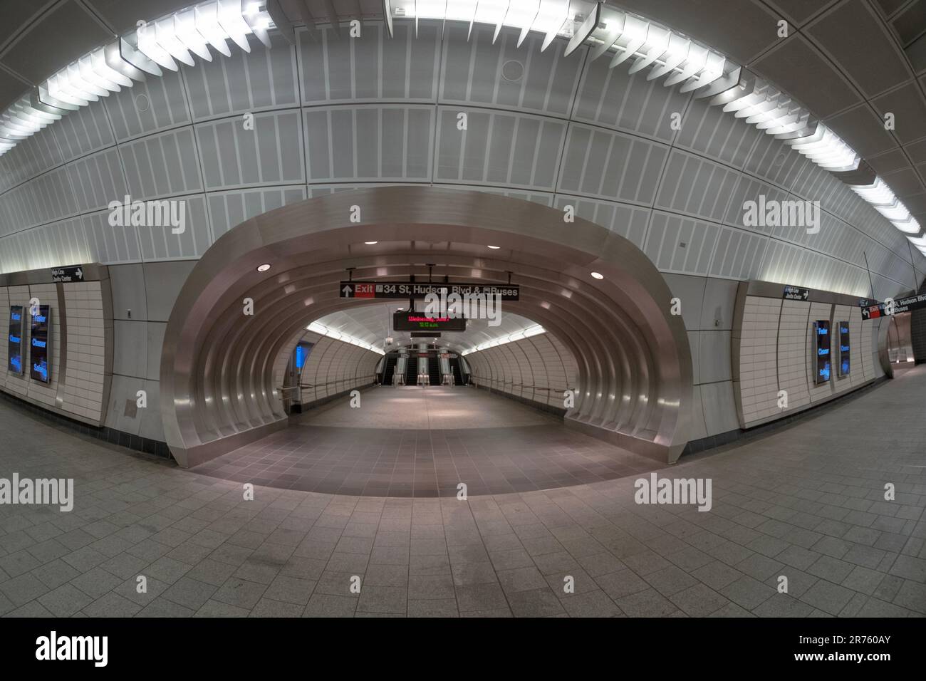 A fisheye lens view of the mezzanine of the last stop on the #7 subway and a walk to the exit on 34th Street Hudson Yards. In new York City. Stock Photo