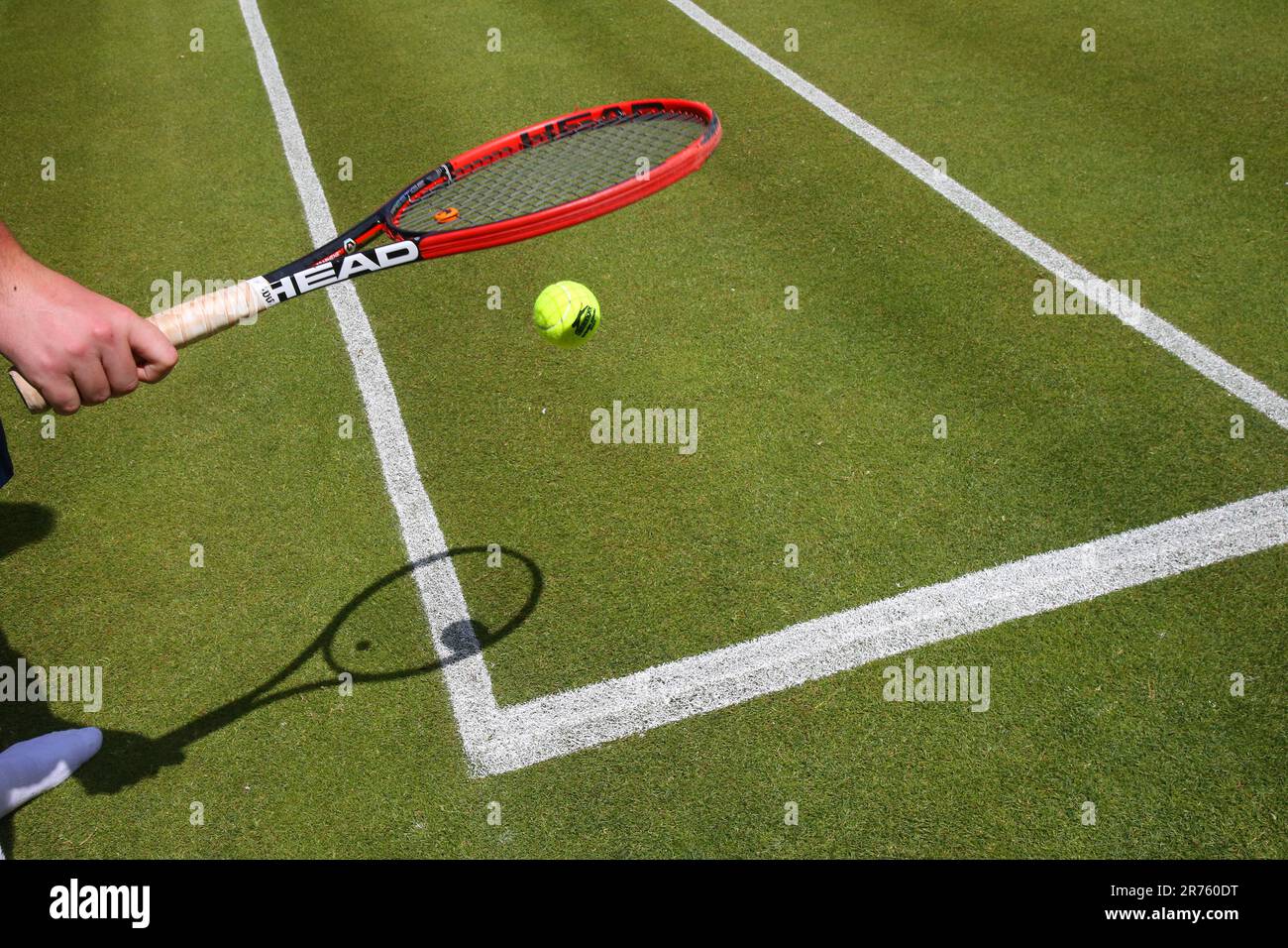 Berlin, Germany. 13th June, 2023. Tennis: Press briefing on WTA tournament:  On socks, a groundskeeper tests the grass quality of the center court  before the bett1 OPEN WTA tournament at the clubhouse