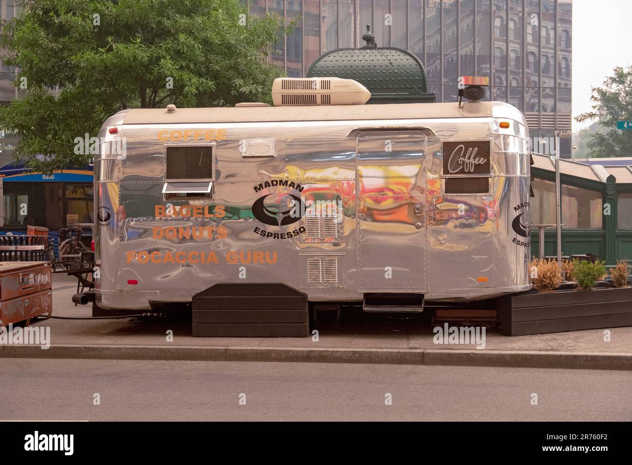 A coffee cart on Astor Place that's a converted Airstream silver trailer. On Astor Place in the East Village near the subway station. Im 2023. Stock Photo