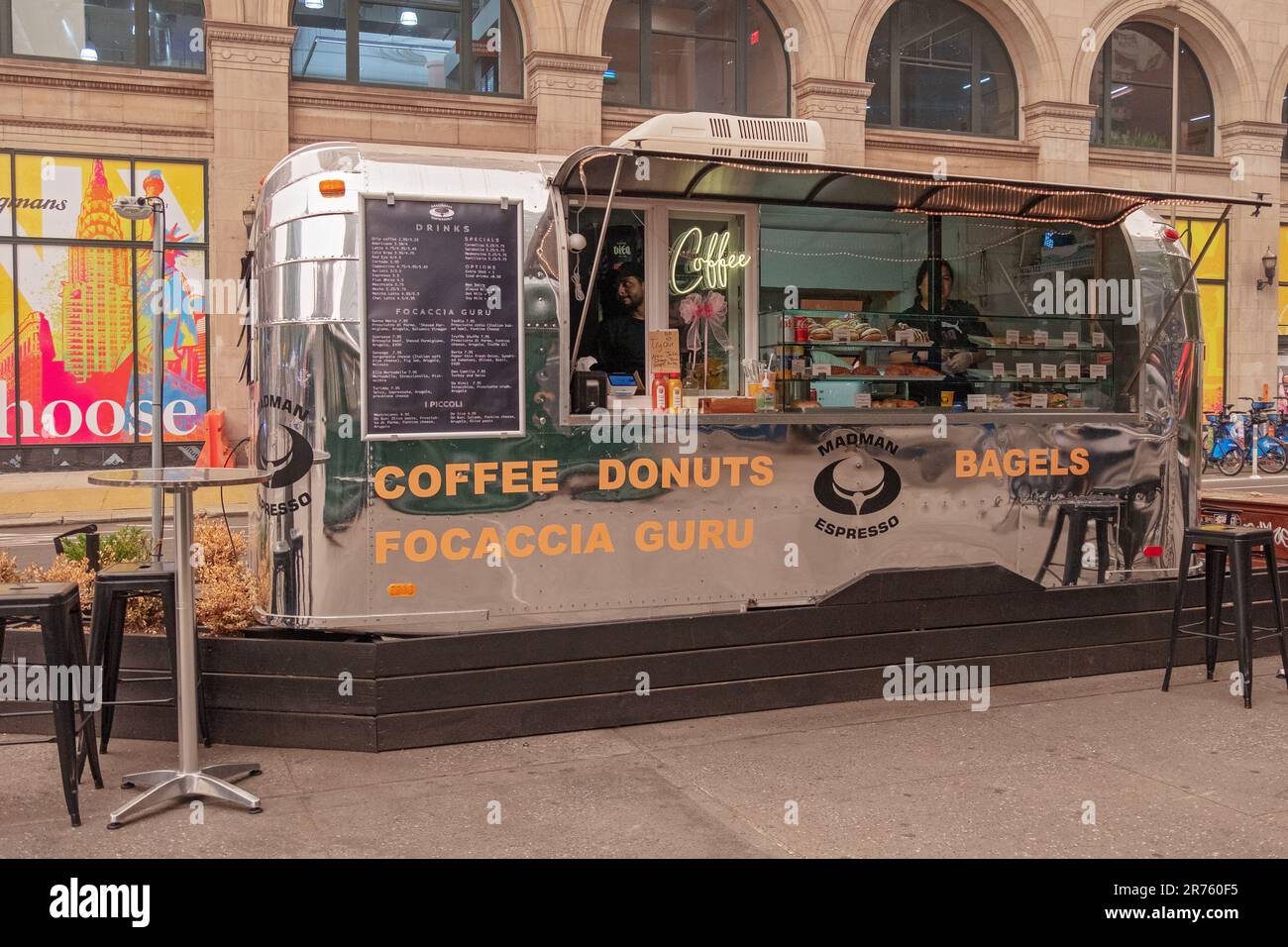 A coffee cart on Astor Place that's a converted Airstream silver trailer. On Astor Place in the East Village near the subway station. Im 2023. Stock Photo