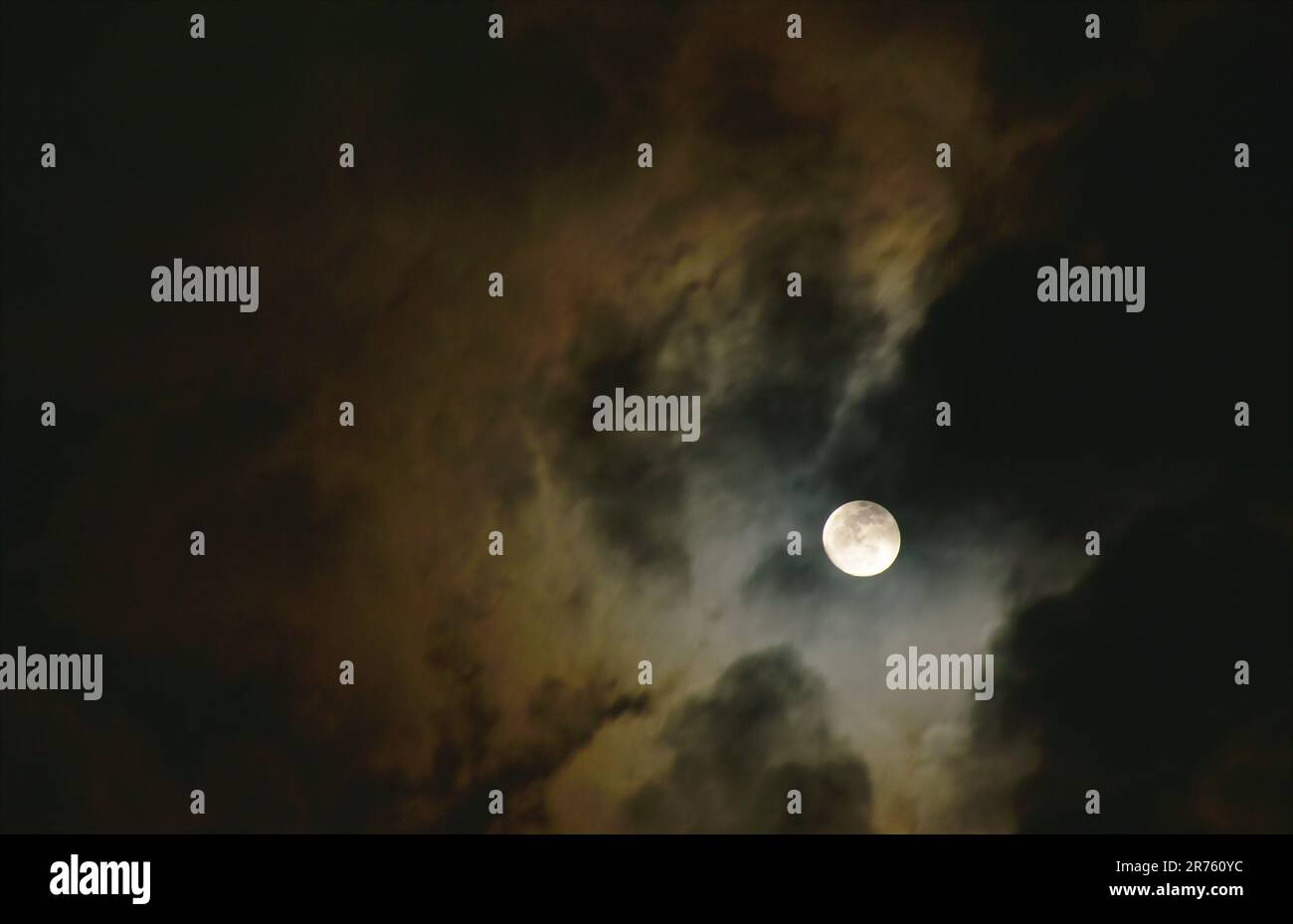 bright moon floating on sky in cloud background Stock Photo