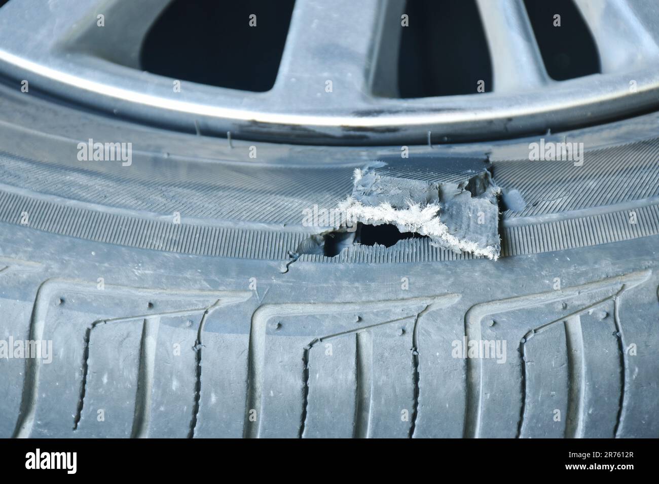 broken tire on magnesium alloy wheel from accident Stock Photo Alamy