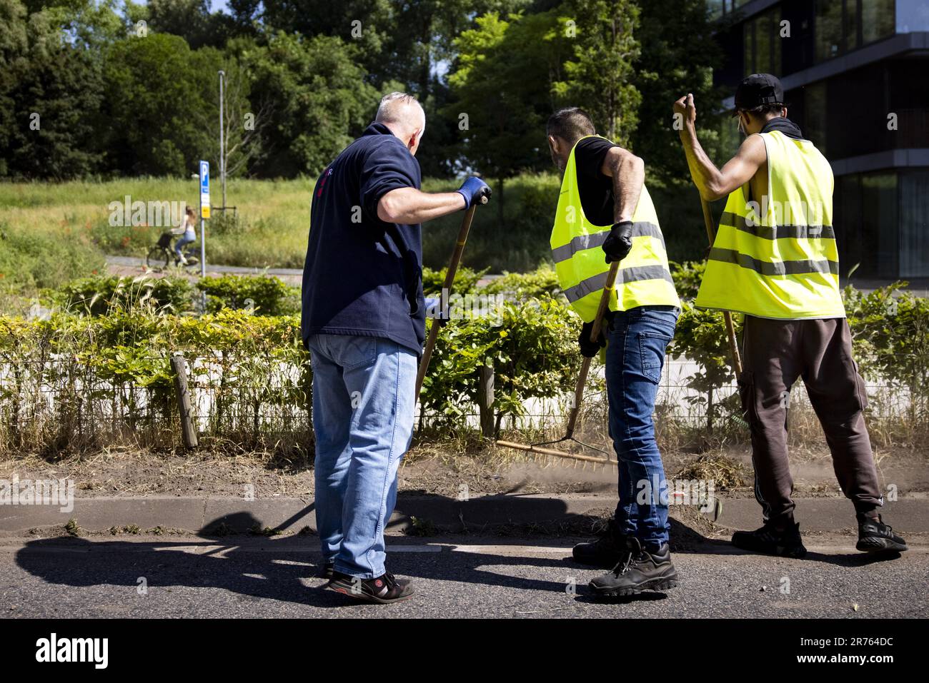 Service At Work AMSTERDAM - Workers, people with community service, at work during ...