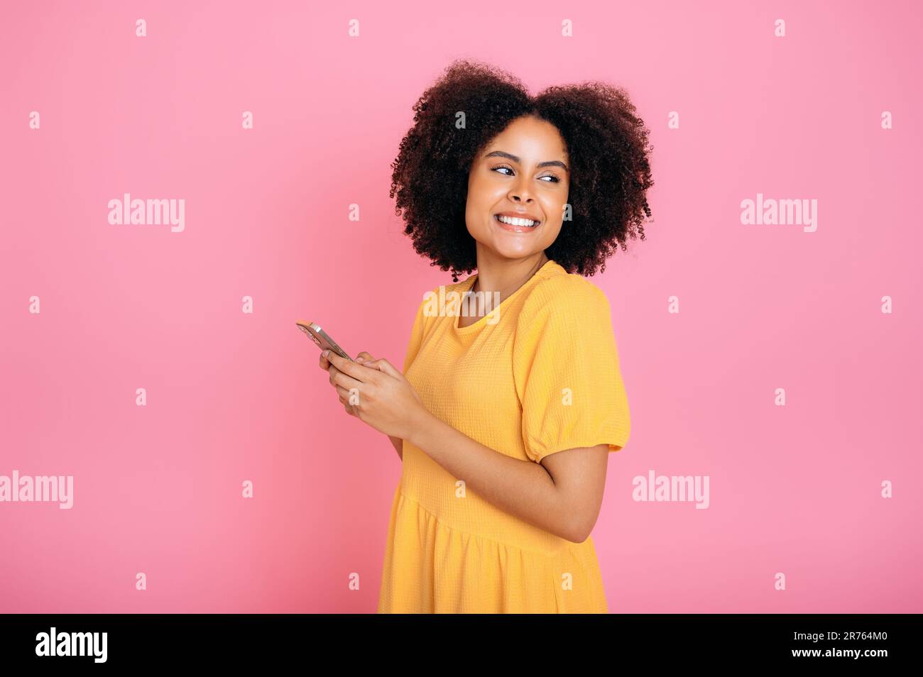 African woman happy texting hi-res stock photography and images - Alamy