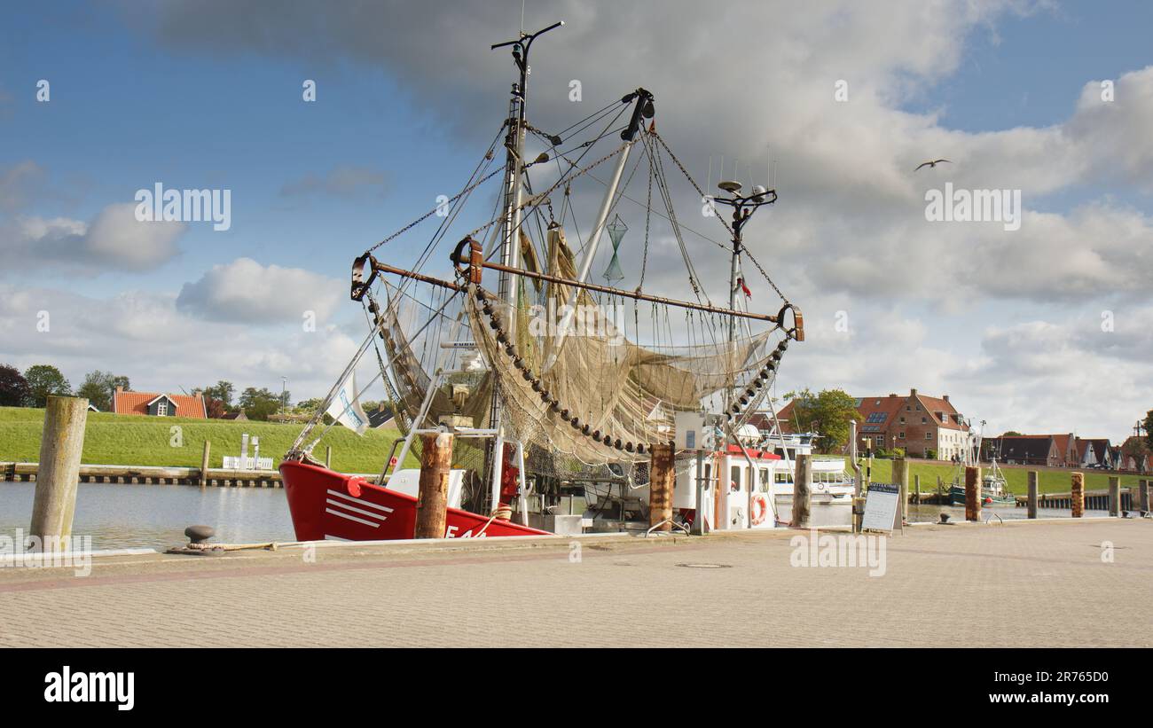 A Crab Cutter, a fishing boat for shrimp and crab, in the harbour of Greetsiel, a small picturesque fishing town in North Frisia. Stock Photo
