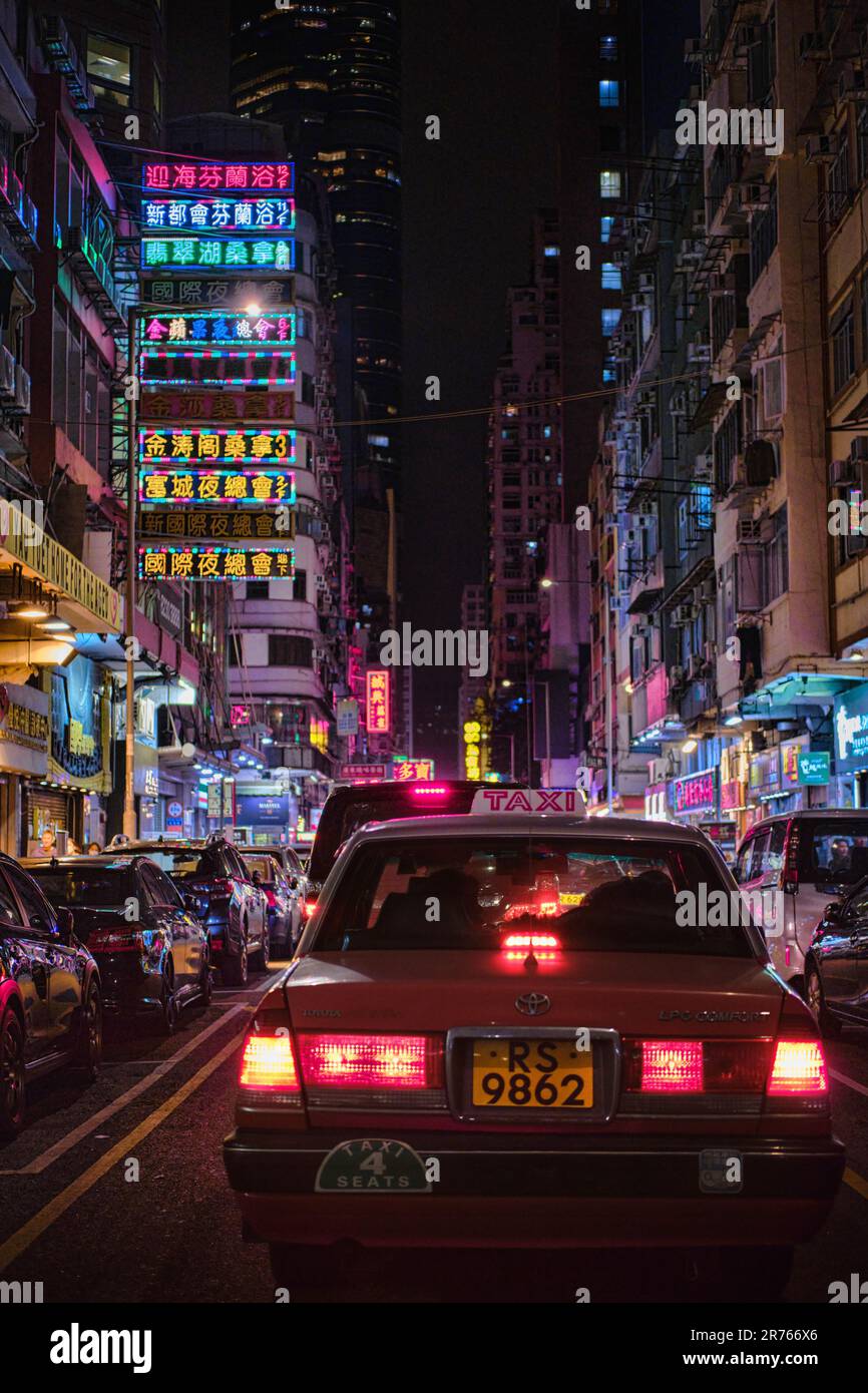 Mong Kok, Hong Kong - April 12 2023: A Traditional red Taxi and