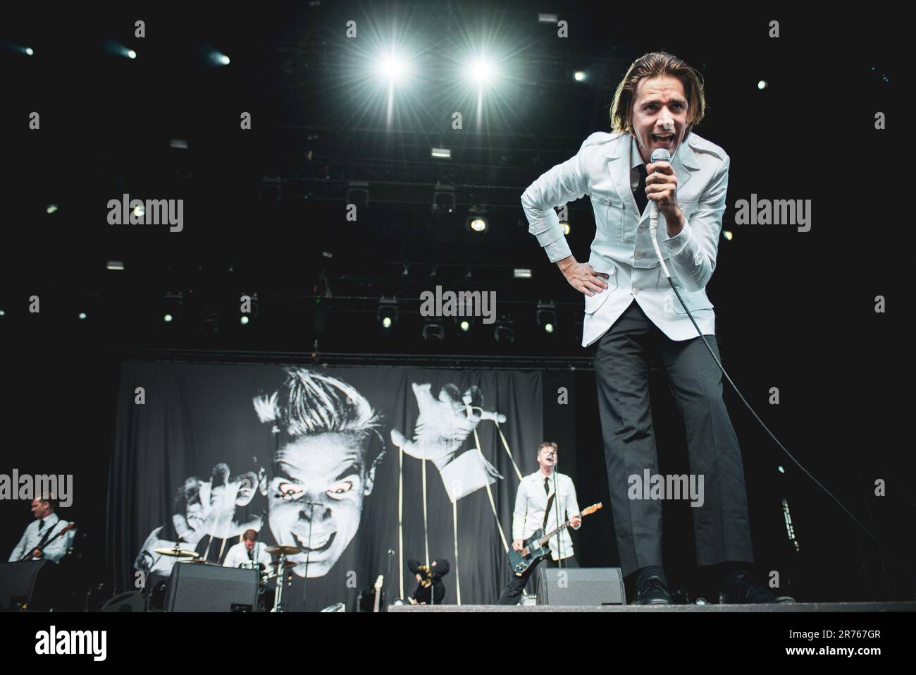 MUNICH, GERMANY ROCKAVARIA FESTIVAL: Per “Pelle” Almqvist, also known as Howlin' Pelle Almqvis, singer of the Swedish band The Hives performing live on stage at the first edition of the Rockavaria Festival. Stock Photo