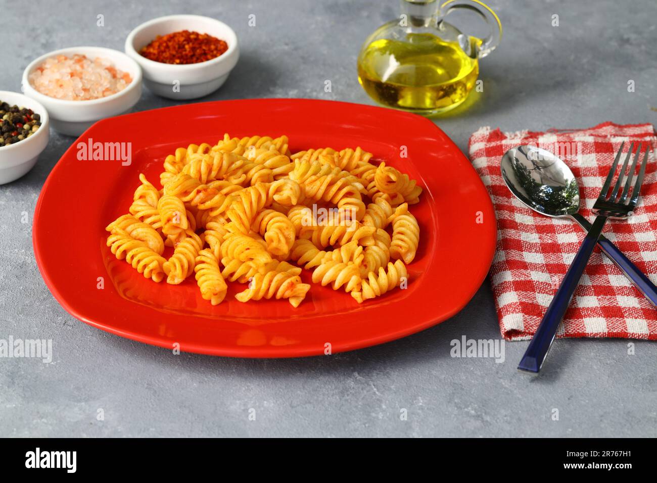 Fusilli pasta in tomato sauce. gray background. Italian food concept ...