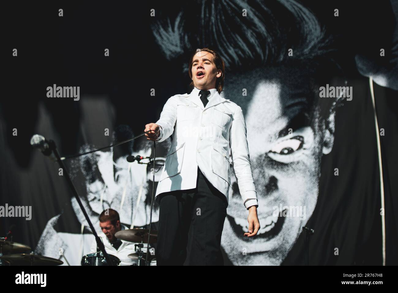 MUNICH, GERMANY ROCKAVARIA FESTIVAL: Per “Pelle” Almqvist, also known as Howlin' Pelle Almqvis, singer of the Swedish band The Hives performing live on stage at the first edition of the Rockavaria Festival. Stock Photo